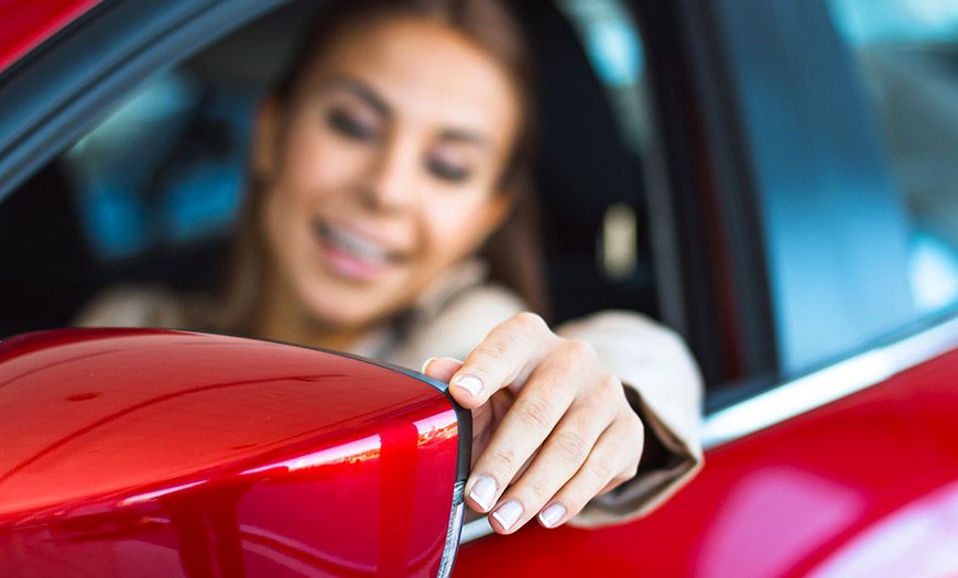 Girl in a Red Car with Car Insurance in Medina, OH, North Royalton, Litchfield, OH, and Surrounding Areas