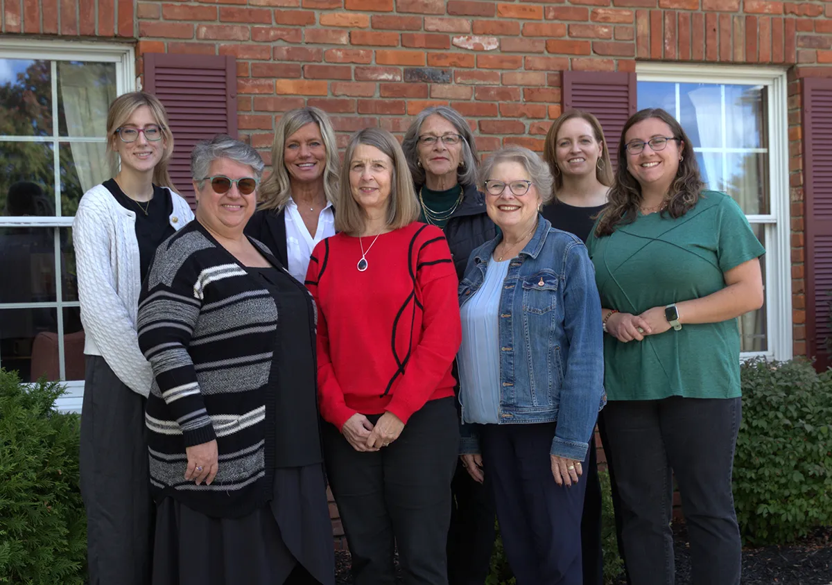 The staff of Homestead Insurance standing outside their office